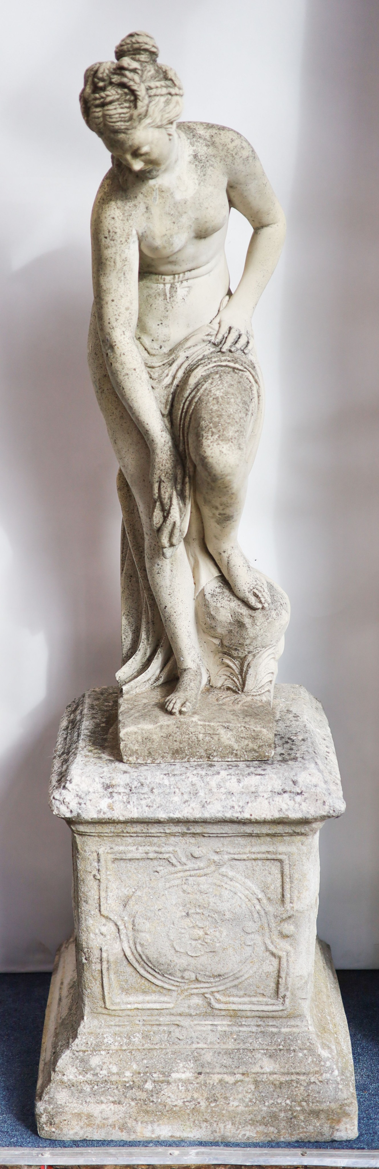 A 19th century carved marble statue of Venus, raised on a reconstituted plinth, height 135cm